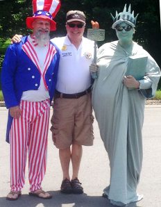 Fred Mazur stands proud with Uncle Sam & Lady Liberty